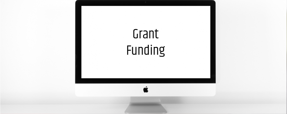 iMac that has the word grants on the screen